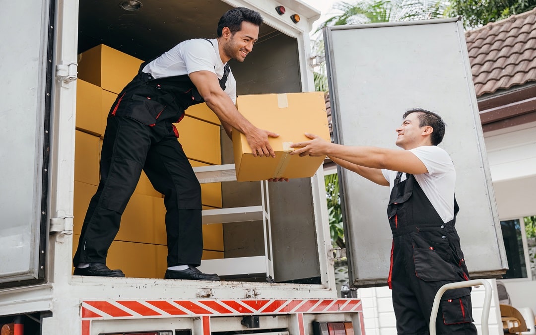 employees of a removal company unloading boxes